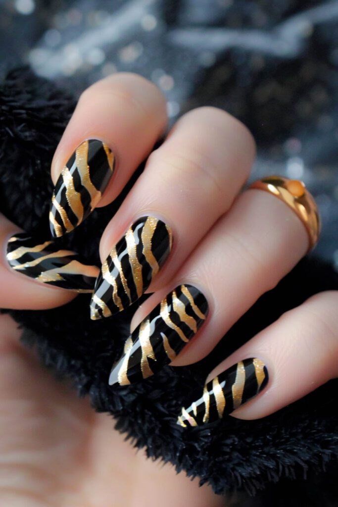 Animal Print - gold and black nails